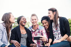 group-women-laughing-phone-600px