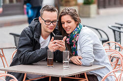 Couple-watching-video-ad-on-phone